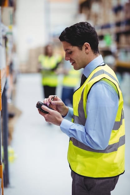 A medium shot of a warehouse worker using a handheld device to scan a barcode on a package, with automated conveyor belts and shelves of inventory visible in the background, highlighting the integration of technology in warehouse management.