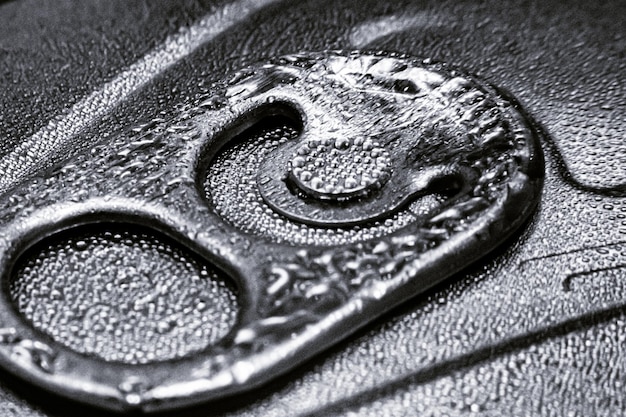 A fireproof and waterproof safe containing a metal plate engraved with a recovery seed phrase. The setting emphasizes the importance of physical security and protection against environmental factors.