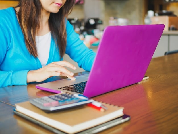 A person using a laptop to access a college cost calculator website, with financial documents and a pen neatly arranged on the desk. The scene showcases the process of researching and estimating college expenses using online tools, with a focus on accuracy and attention to detail.