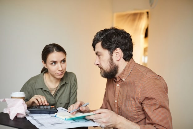 A person talking to a financial advisor about debt management options.