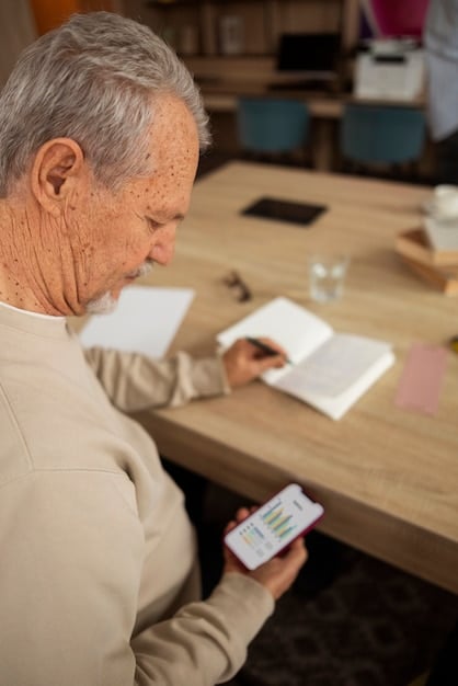 A person using a mobile app on their smartphone to monitor their retirement savings progress with charts, graphs and positive indicators. The setting is a modern, minimalist office.