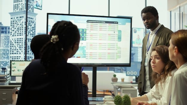 A diverse group of people in a modern office collaboratively discussing investment strategies, with charts and graphs visible on a large screen.