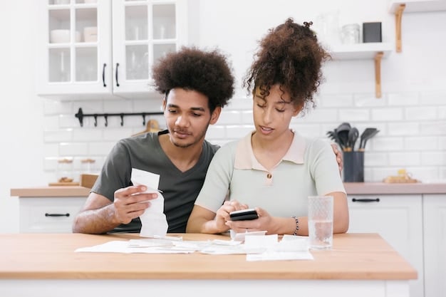 Two people at a table, one talking on a phone with a friendly expression, and the other taking notes on a notepad, suggesting a successful negotiation with creditors for better debt repayment terms.