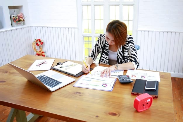 A person reviewing their budget on a laptop, with receipts and financial documents scattered around.