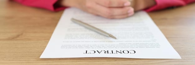 A close-up shot of a signed contract, emphasizing the importance of legal and ethical obligations in financial advisory. The focus is on the signature and the clauses related to fiduciary responsibility, with a blurred background of legal documents.